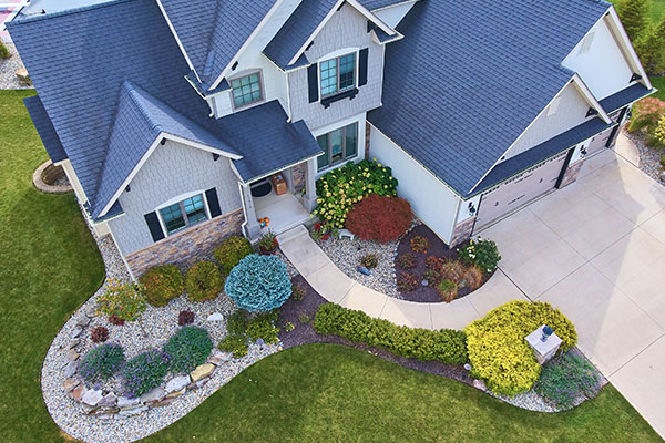 Aerial view of house that has home insurance coverage